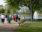 walkers passing by Centennial Fountain